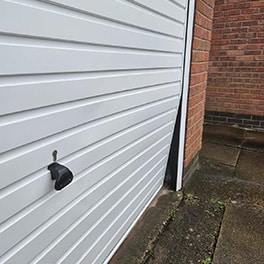 Damaged garage door bent out of shape